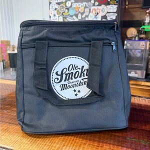 Black “Ole Smoky Moonshine” insulated cooler, and or lunch bag.